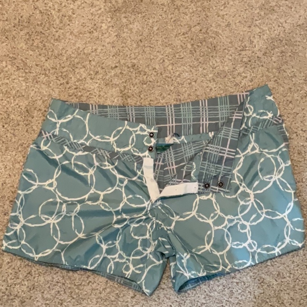Carve Designs Teal and White Patterned water shorts that are reversible